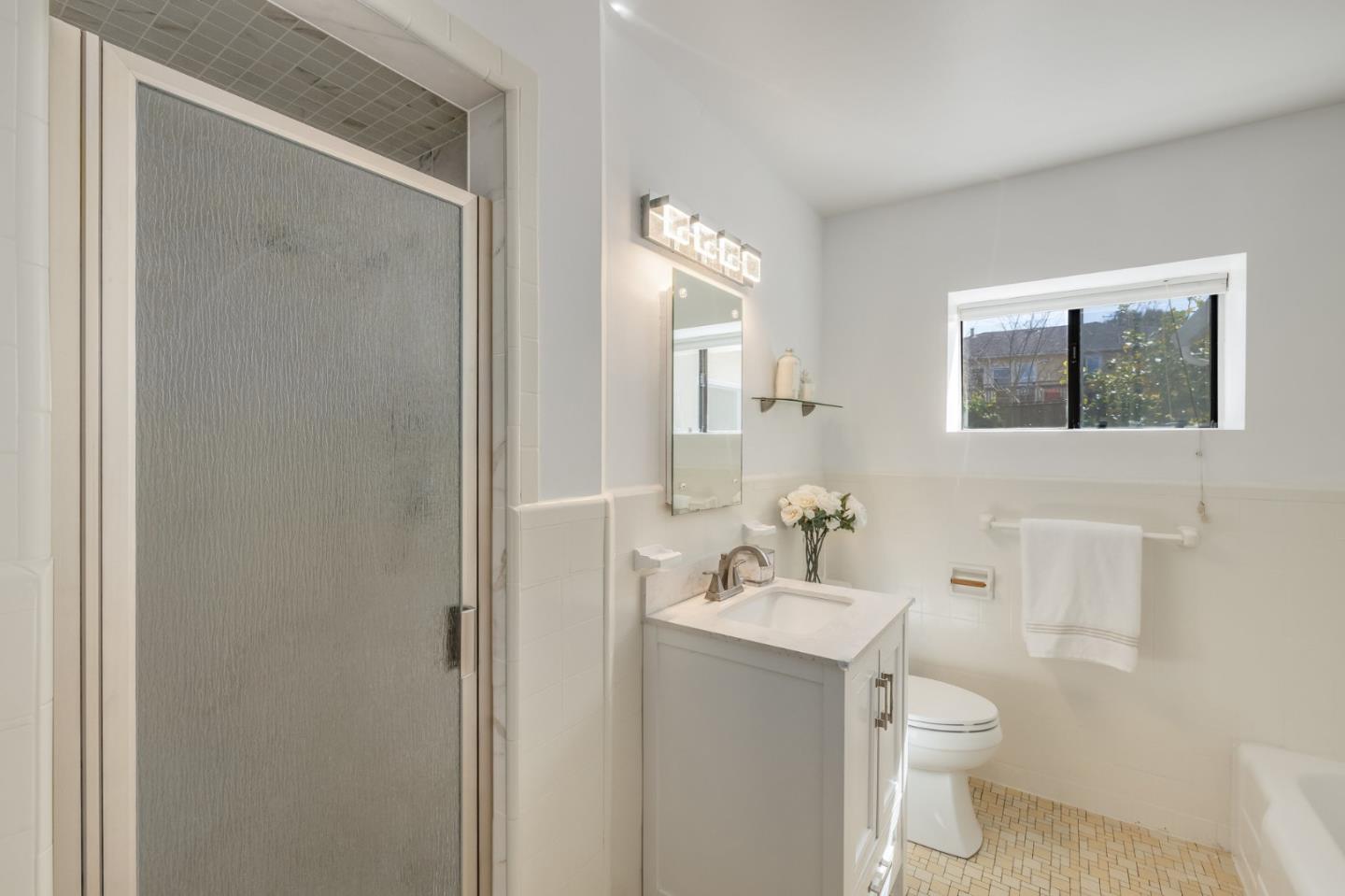 419 Millwood Drive Millbrae, CA 94030 - Photo 17 of 32 a bathroom with a toilet sink and mirror