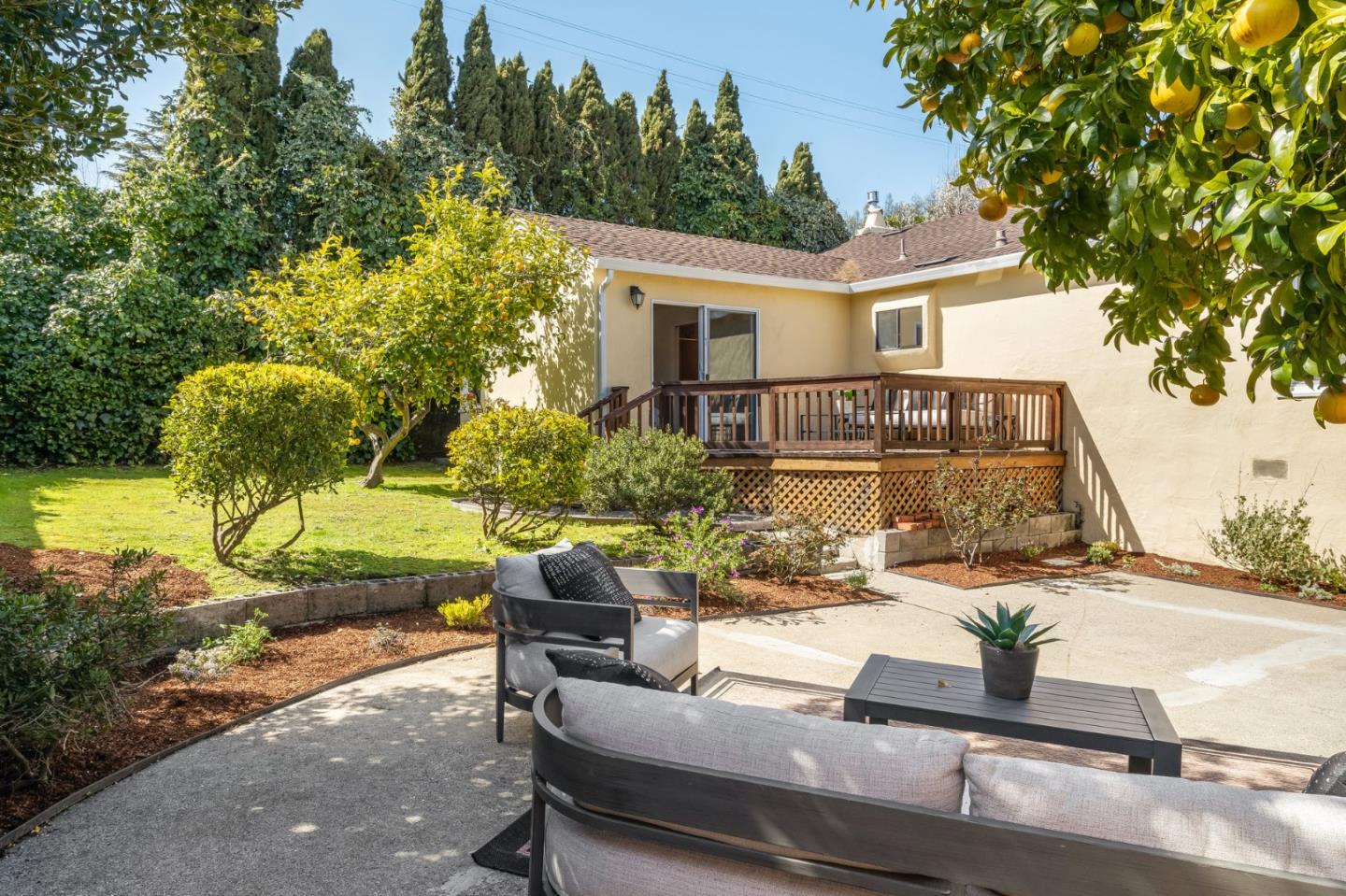 419 Millwood Drive Millbrae, CA 94030 - Photo 27 of 32 a view of a patio with couches table and chairs and potted plants