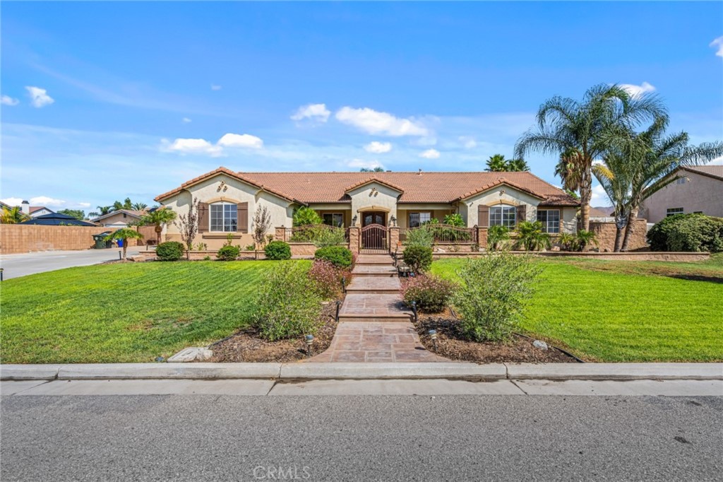 10003 Willowbrook Road Riverside, CA 92509 - Photo 1 of 1 a front view of house with yard and green space