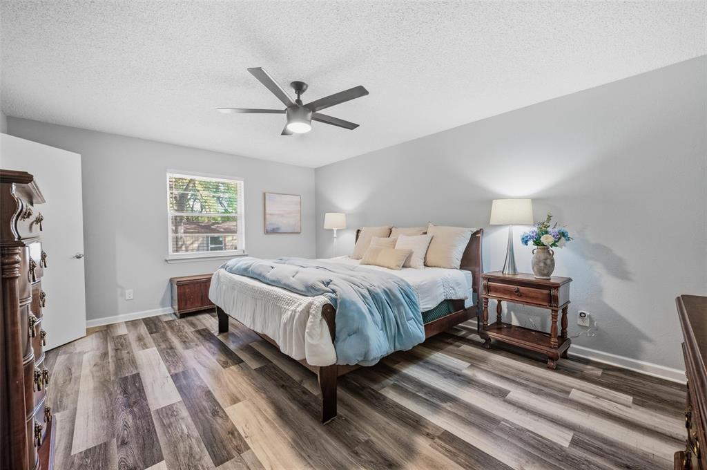 608 Ridgewood Circle Hurst, TX 76054 - Photo 22 of 38 Wood-finish flooring, ceiling fan, window with natural light, and light-toned walls