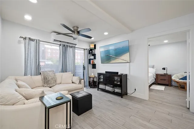 a living room with furniture fireplace and a flat screen tv