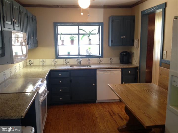58 Ark Road Medford, NJ 08055 - Photo 2 of 13 a kitchen with a sink and a window