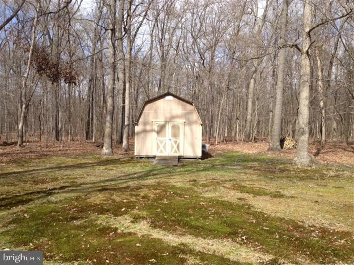 58 Ark Road Medford, NJ 08055 - Photo 12 of 13 a view of a tiny house with a yard