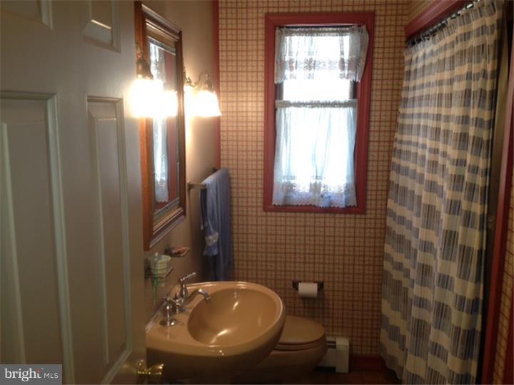 58 Ark Road Medford, NJ 08055 - Photo 6 of 13 a bathroom with a sink a window and mirror