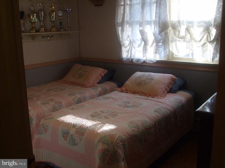 58 Ark Road Medford, NJ 08055 - Photo 9 of 13 a bedroom with a bed and a window