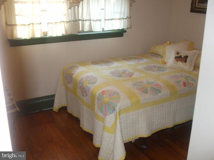 58 Ark Road Medford, NJ 08055 - Photo 10 of 13 a bed sitting in a bedroom next to a window