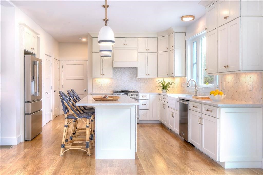 27 Massasoit Avenue Bristol, RI 02809 - Photo 3 of 7 Similar Kitchen finish by builder with center island.