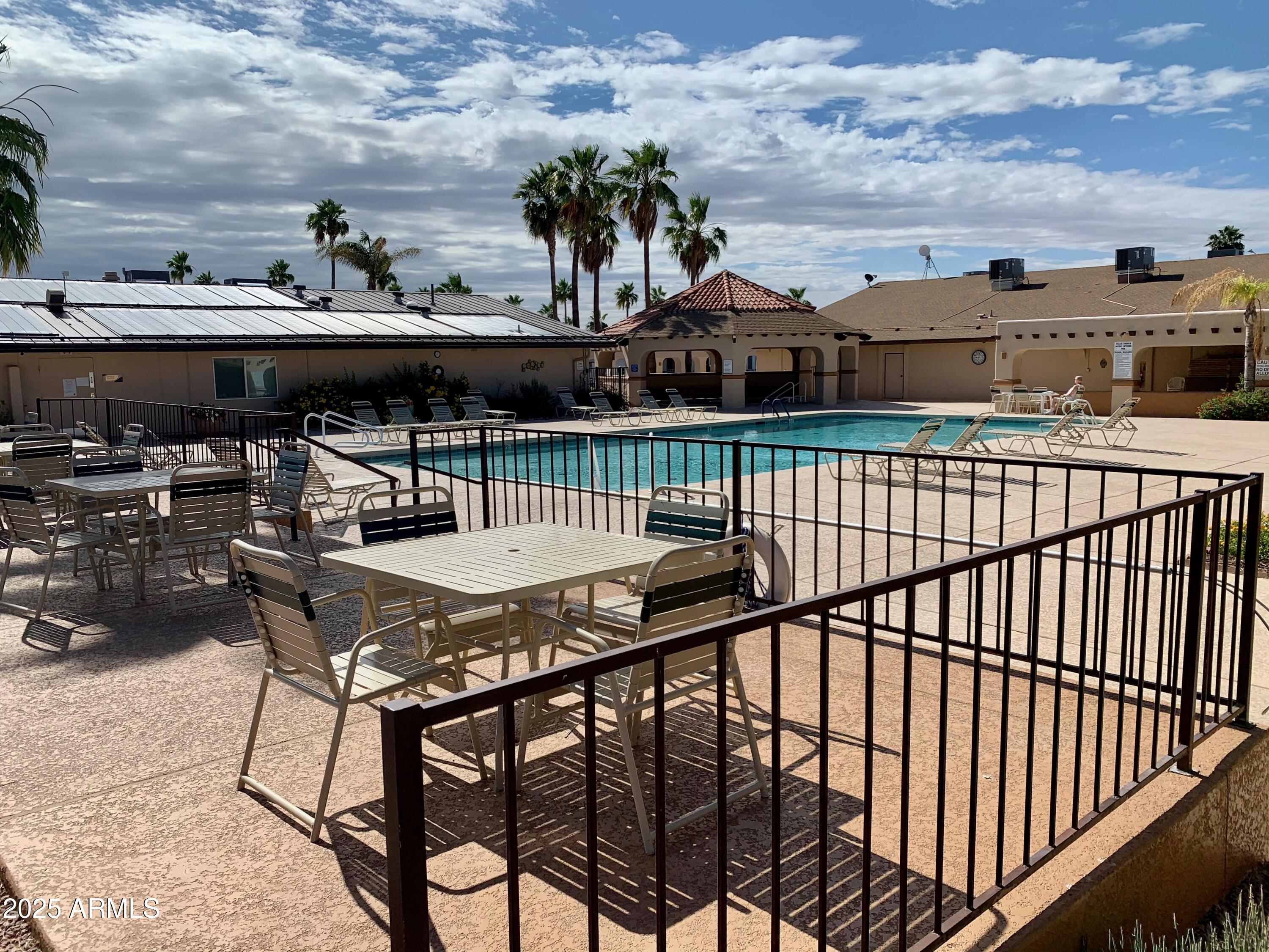 837 Aquamarine Drive, Unit 837 Apache Junction, AZ 85119 - Photo 10 of 34 a view of a terrace with furniture and stove