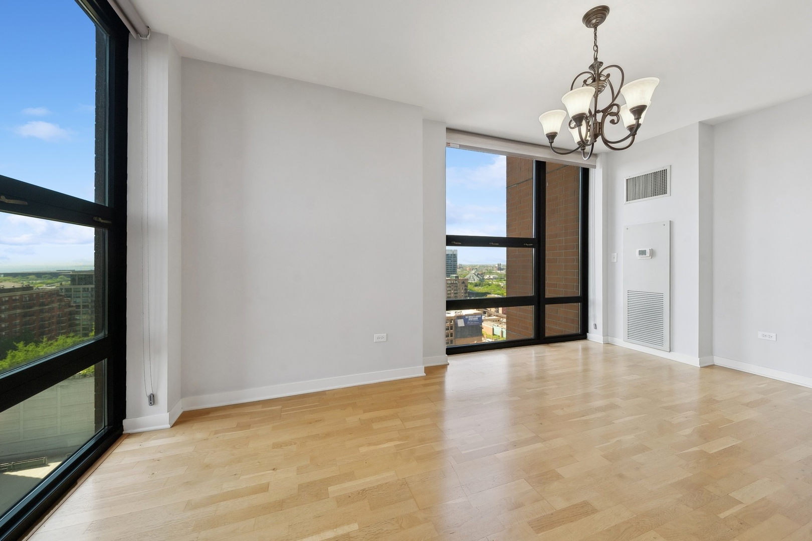 1160 South Michigan Avenue, Unit 2001 Chicago, IL 60605 - Photo 12 of 33 a view of an empty room with a window