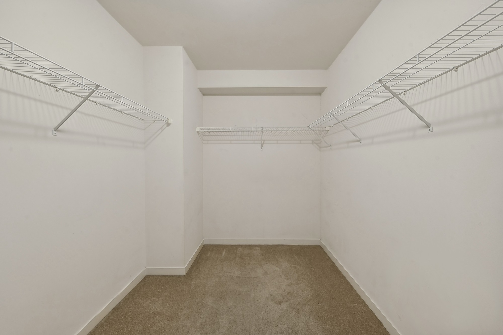 1160 South Michigan Avenue, Unit 2001 Chicago, IL 60605 - Photo 19 of 33 a view of a room with racks on the wall