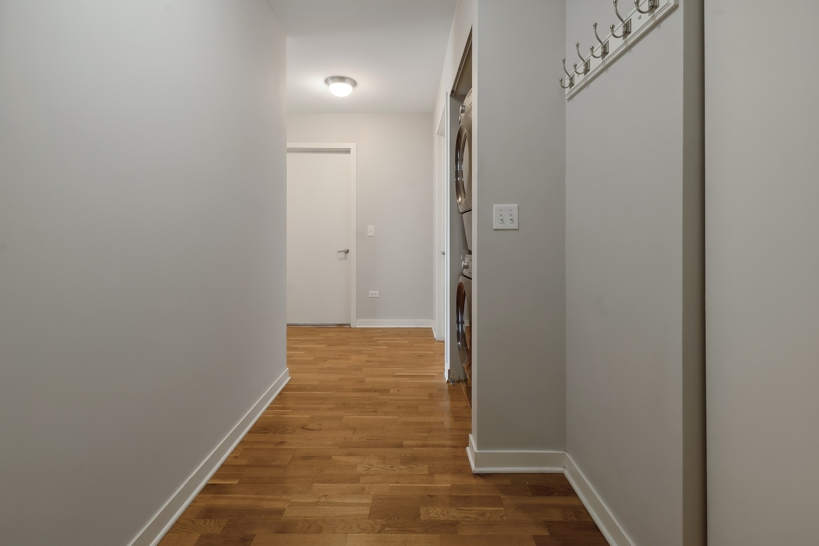 1160 South Michigan Avenue, Unit 2001 Chicago, IL 60605 - Photo 2 of 33 a view of hallway with wooden floor