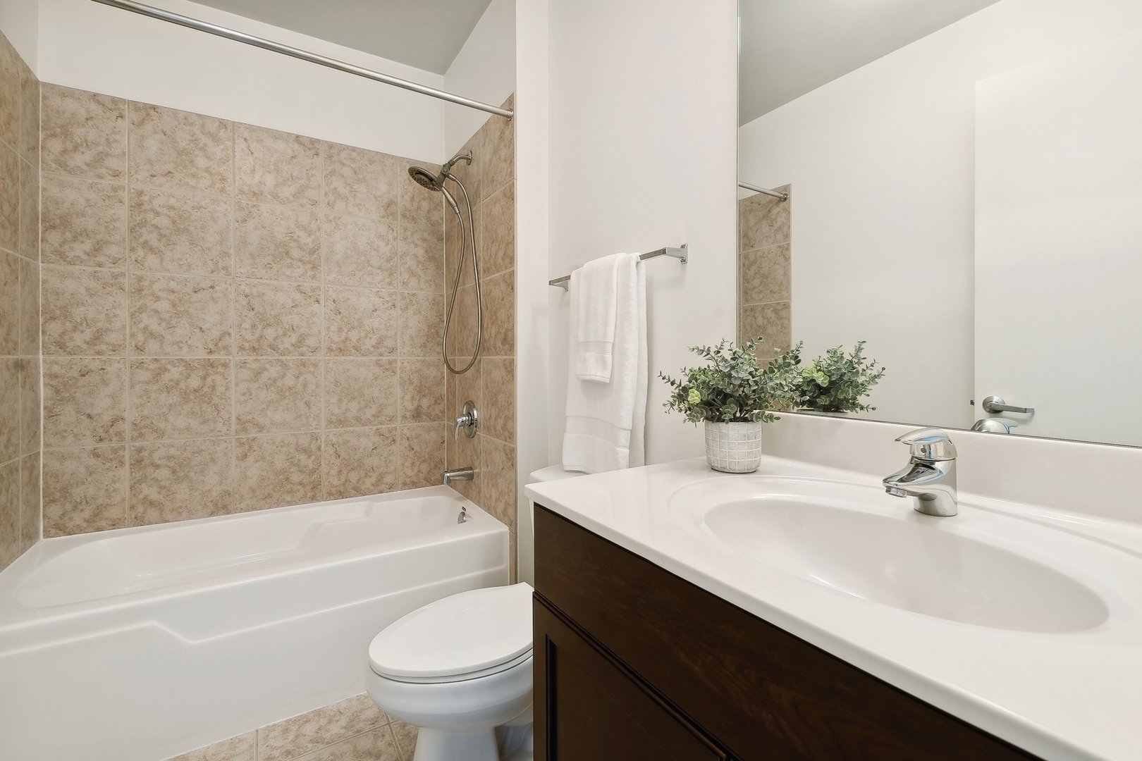 1160 South Michigan Avenue, Unit 2001 Chicago, IL 60605 - Photo 23 of 33 a bathroom with a sink a toilet and a bathtub