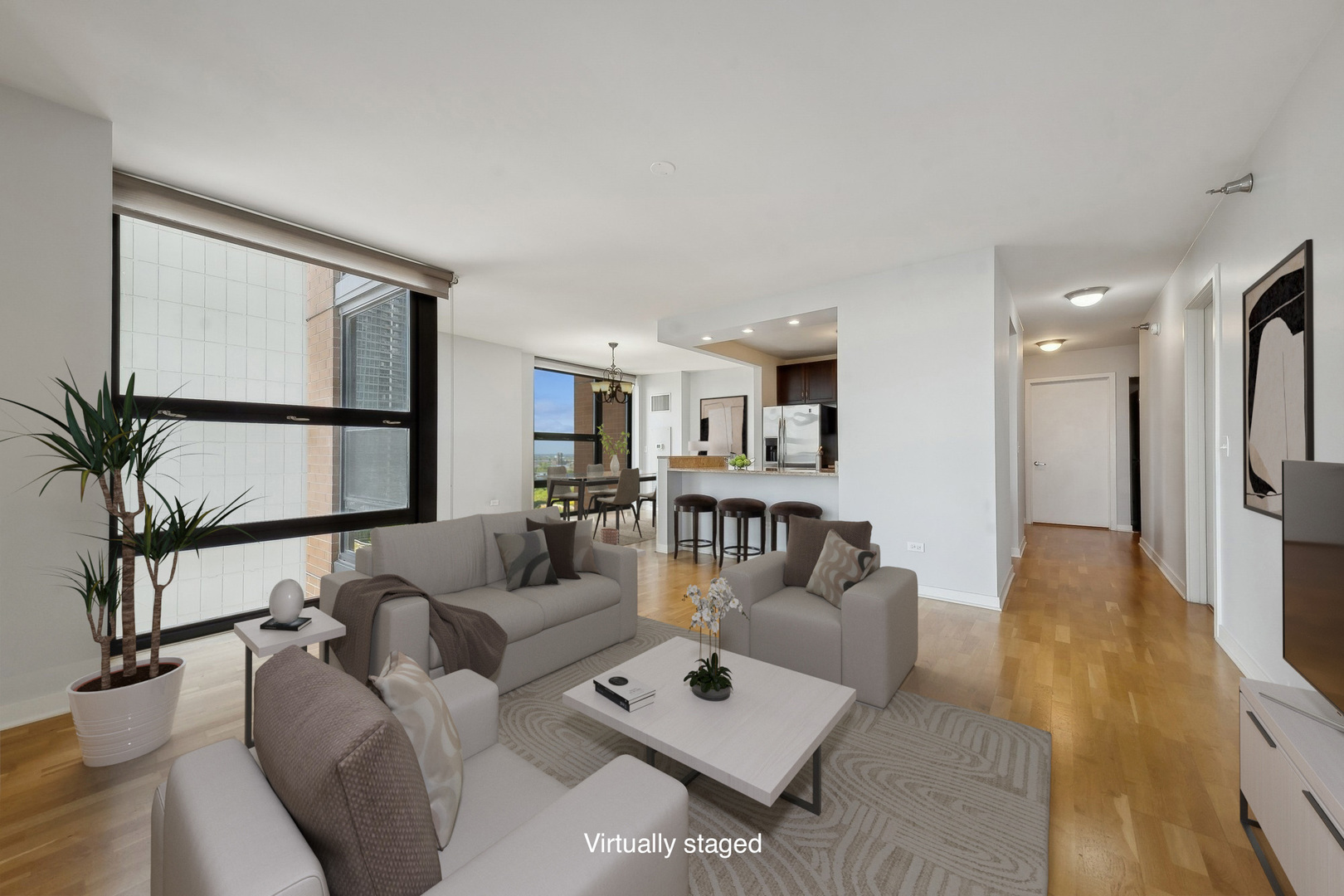 1160 South Michigan Avenue, Unit 2001 Chicago, IL 60605 - Photo 4 of 33 a living room with furniture and a large window