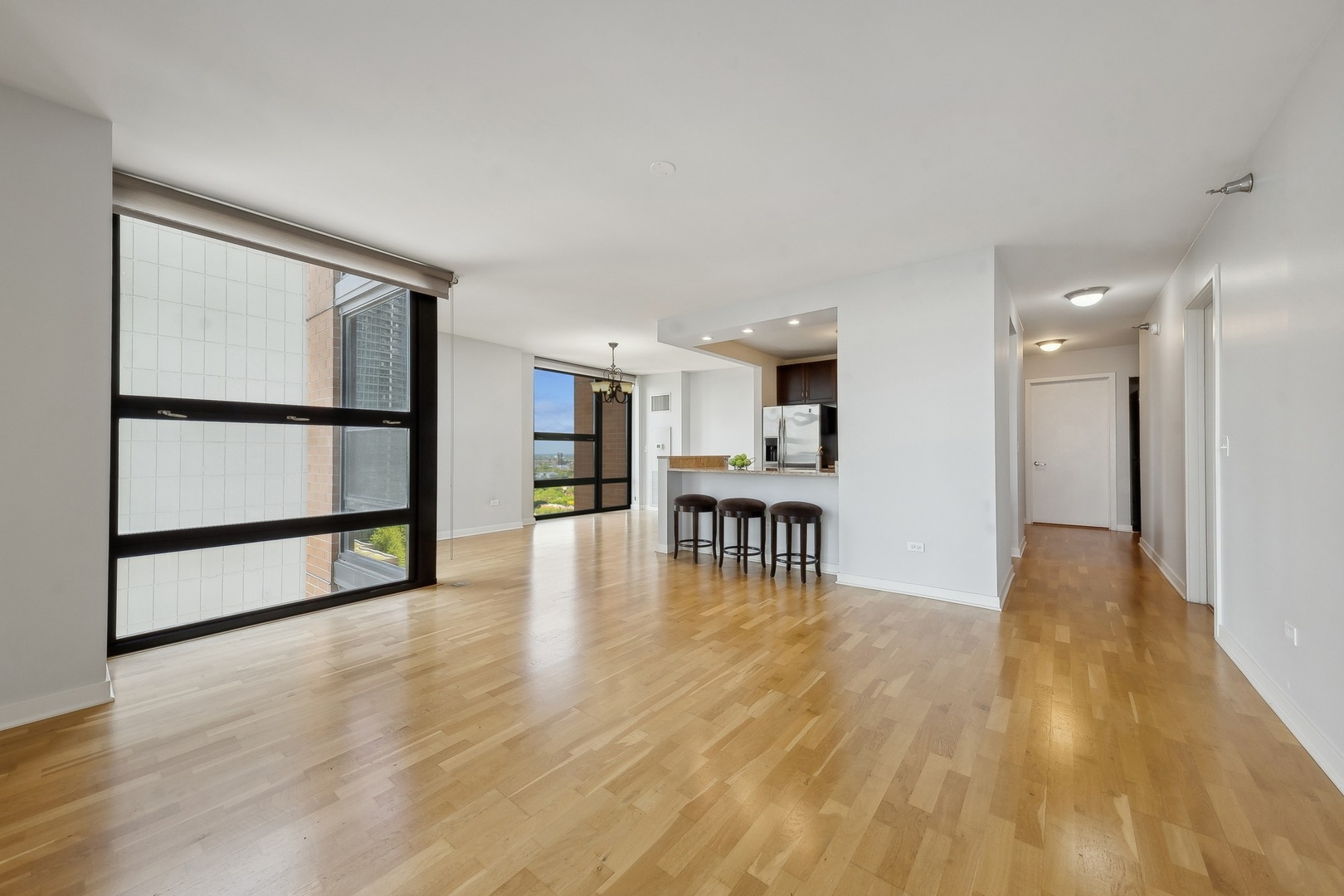 1160 South Michigan Avenue, Unit 2001 Chicago, IL 60605 - Photo 6 of 33 a view of dining room with furniture and wooden floor