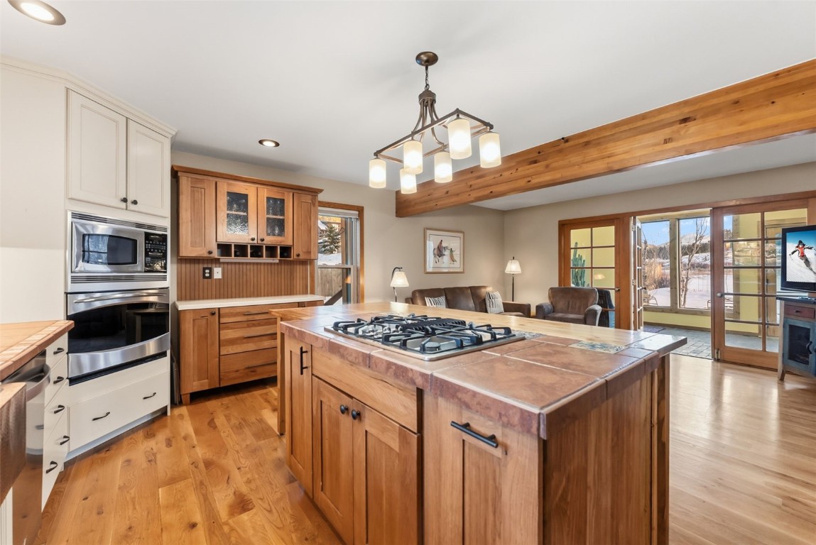 994 Summit Drive Dillon, CO 80435 - Photo 12 of 38 a kitchen with stainless steel appliances granite countertop a stove and a refrigerator