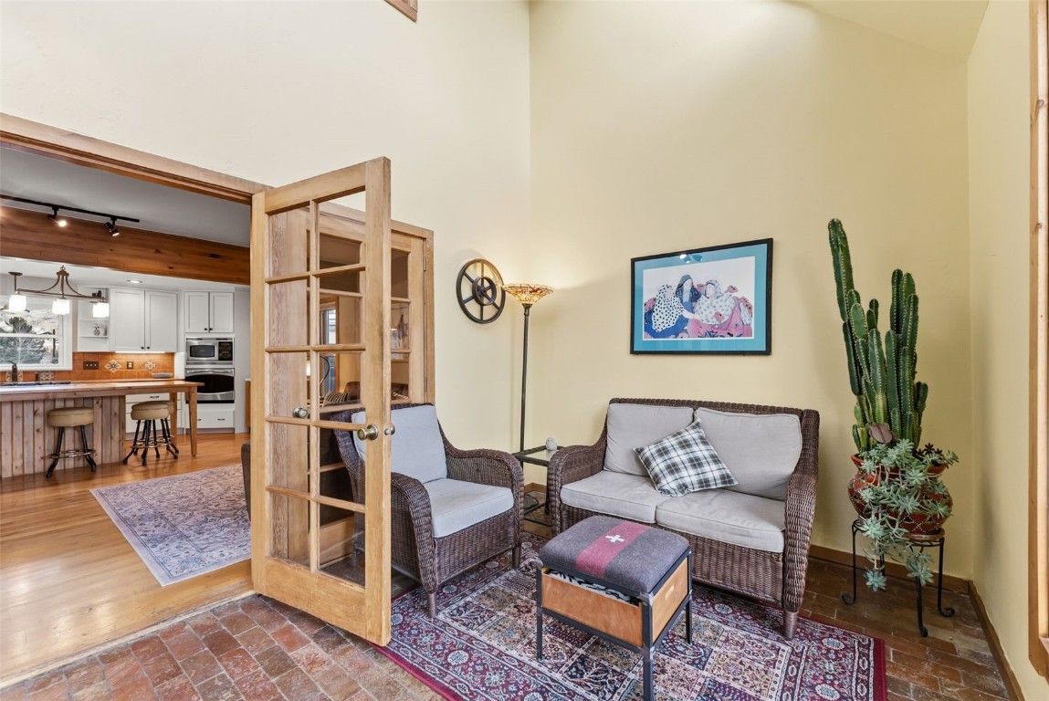 994 Summit Drive Dillon, CO 80435 - Photo 17 of 38 a living room with furniture a rug and wall paintings
