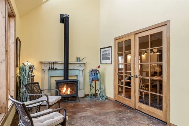 a bathroom with a granite countertop toilet a sink and a mirror