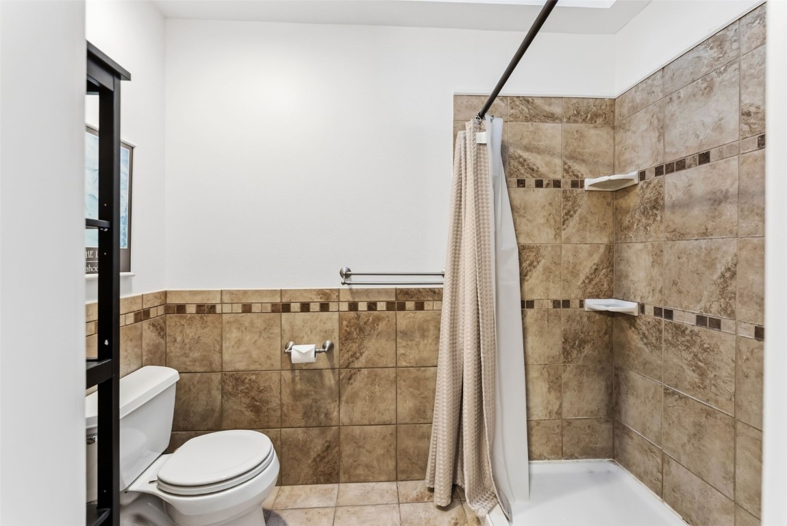 994 Summit Drive Dillon, CO 80435 - Photo 22 of 38 a bathroom with a shower a toilet and a shower