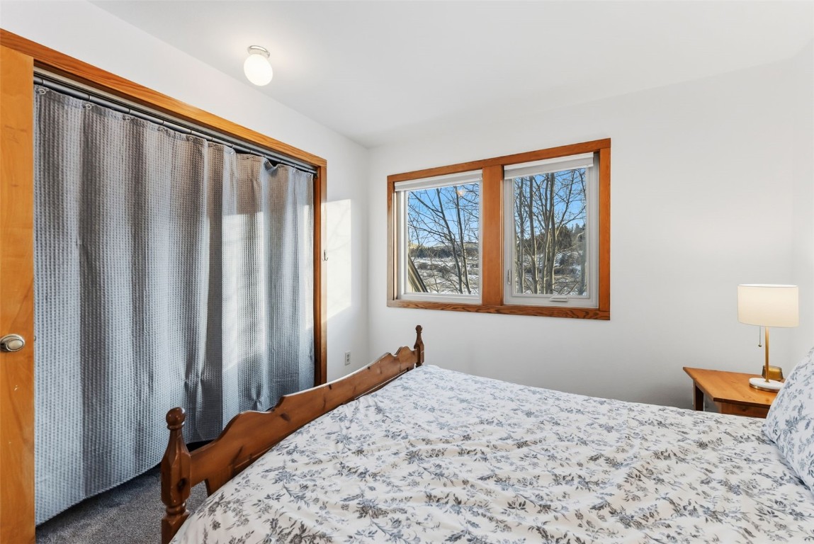 994 Summit Drive Dillon, CO 80435 - Photo 24 of 38 a bedroom with a bed and a window