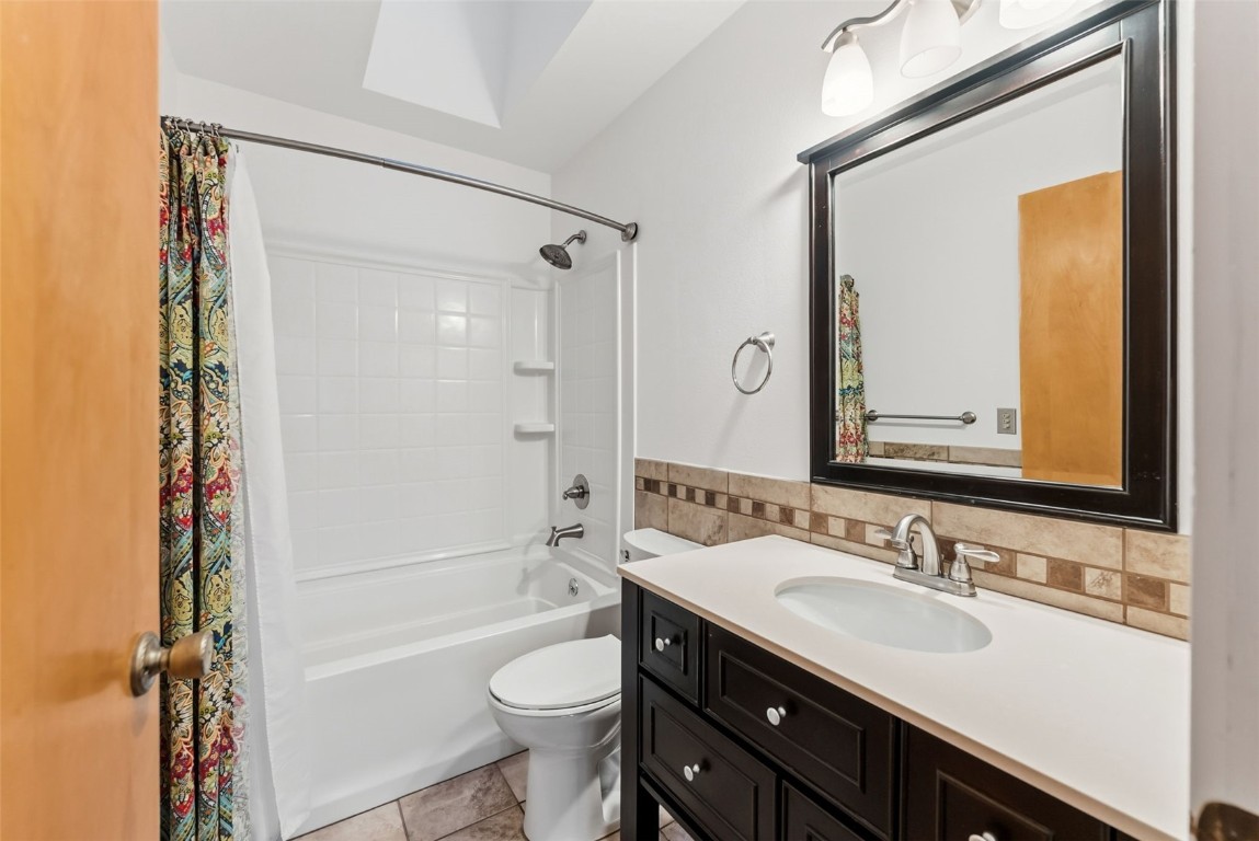 994 Summit Drive Dillon, CO 80435 - Photo 25 of 38 a bathroom with a sink a toilet and shower