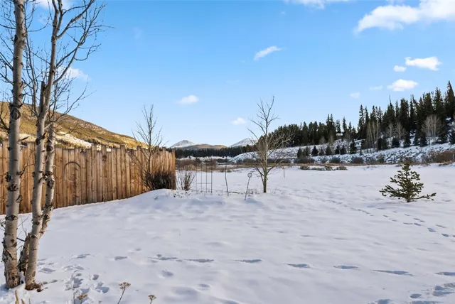 a view of a porch with a table and chairs