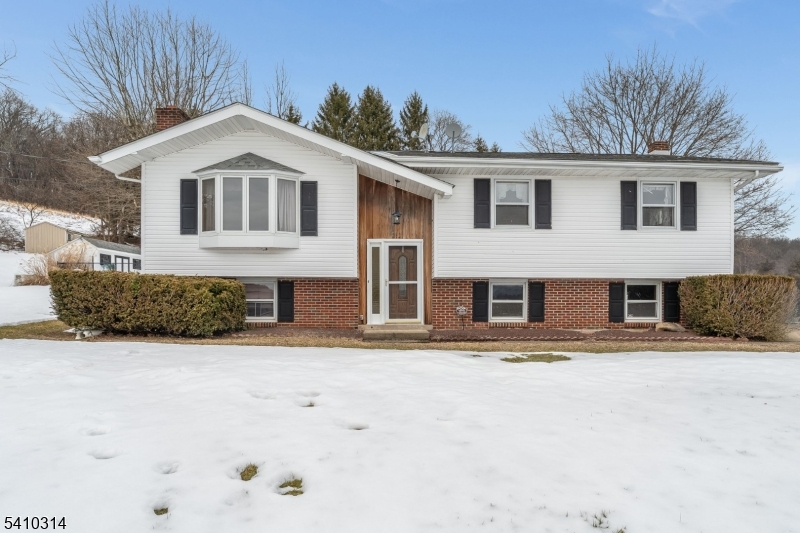 252 Mountain View Road West Asbury, NJ 08802 - Photo 20 of 28 a front view of a house with a yard