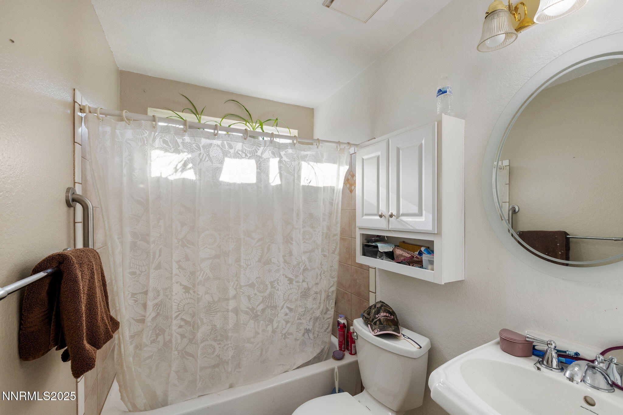 2265 Dakota Way Reno, NV 89506 - Photo 17 of 27 a bathroom with a sink mirror and shower