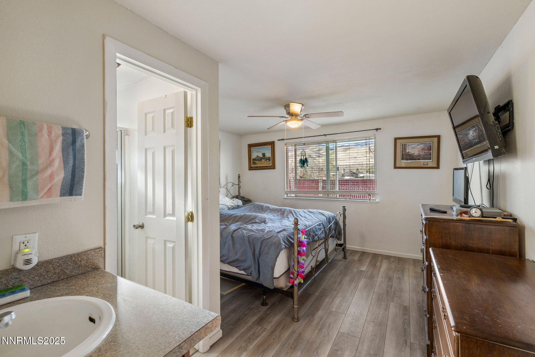 2265 Dakota Way Reno, NV 89506 - Photo 18 of 27 a bedroom with a bed and wooden floor