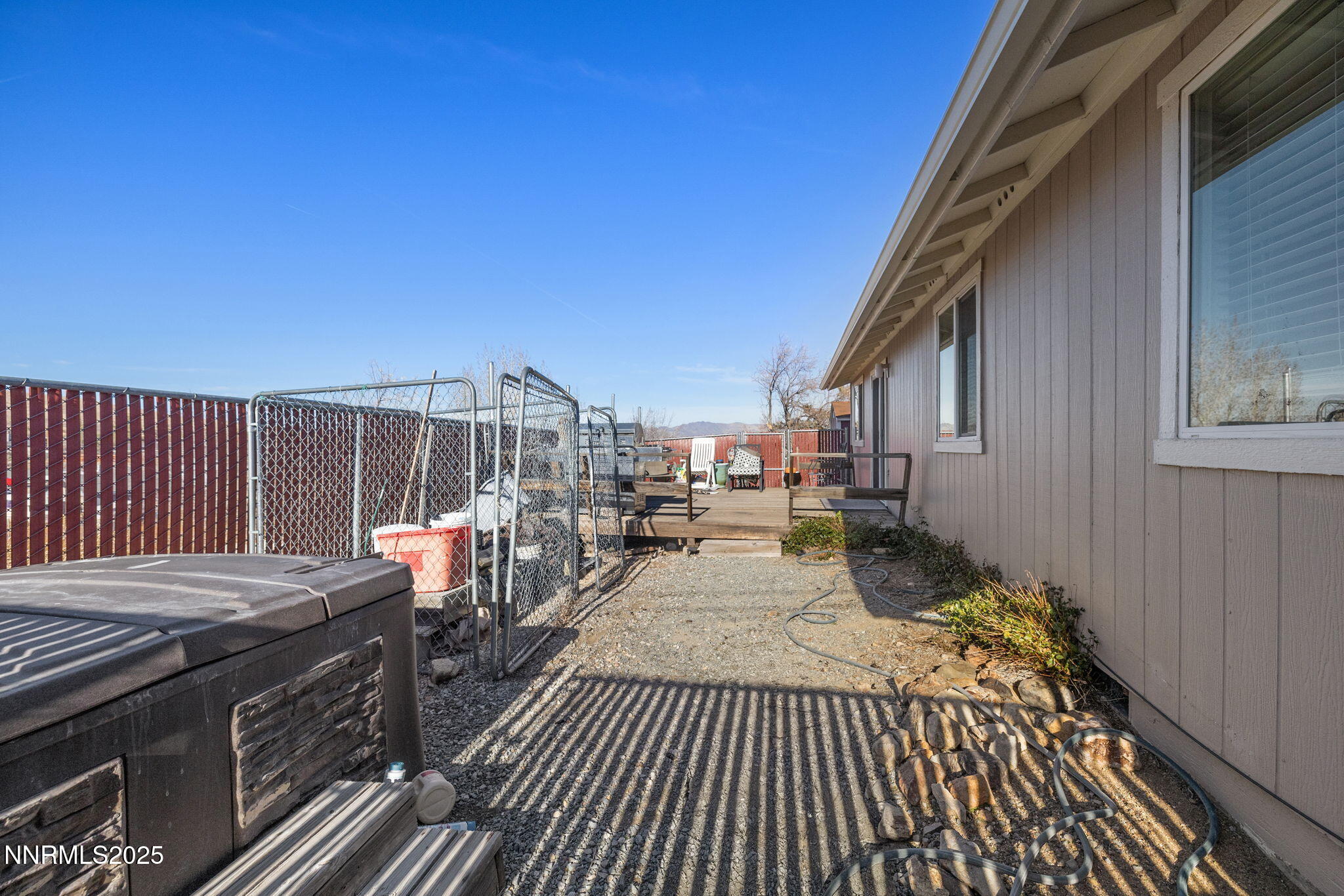 2265 Dakota Way Reno, NV 89506 - Photo 23 of 27 a view of a patio with table and chairs with wooden floor and fence