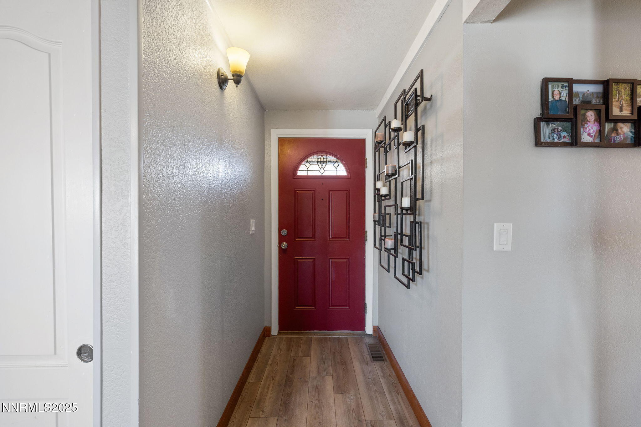 2265 Dakota Way Reno, NV 89506 - Photo 6 of 27 a view of a hallway with wooden floor