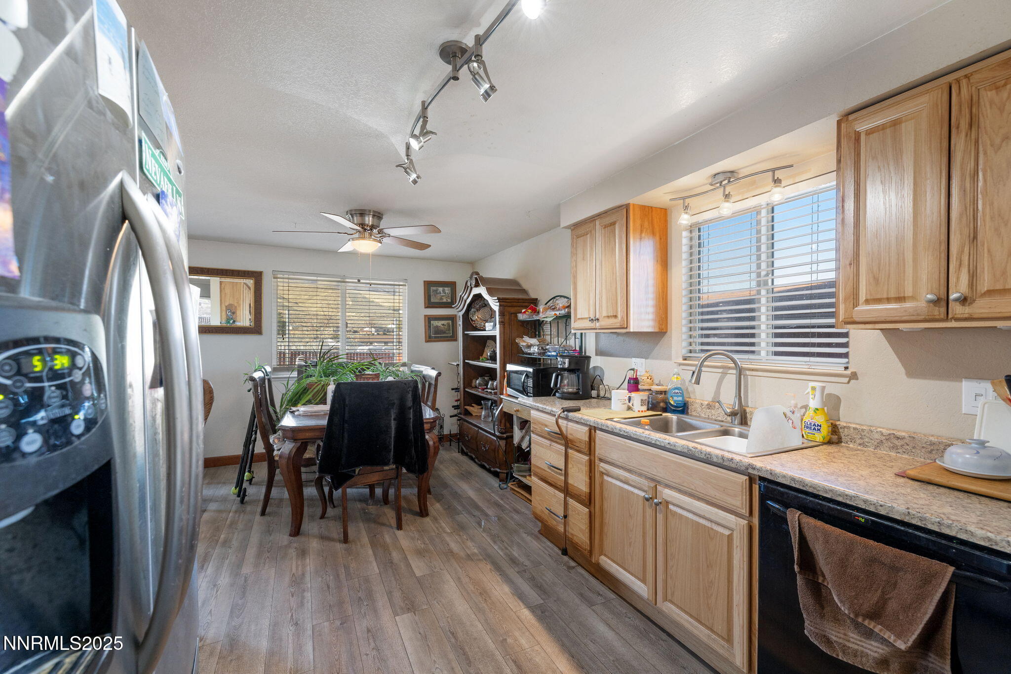 2265 Dakota Way Reno, NV 89506 - Photo 8 of 27 a kitchen with a sink appliances dining table and chairs