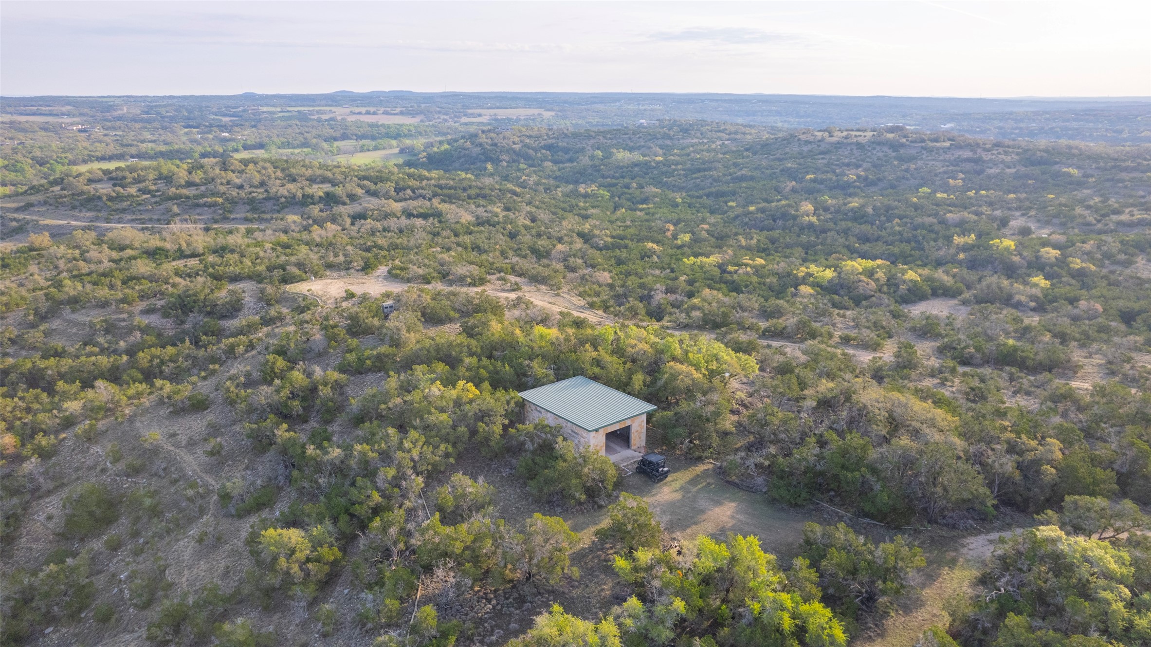 Tbd Bell Springs Road Dripping Springs, TX 78620 - Photo 2 of 40 Aerial view of a heavily wooded area