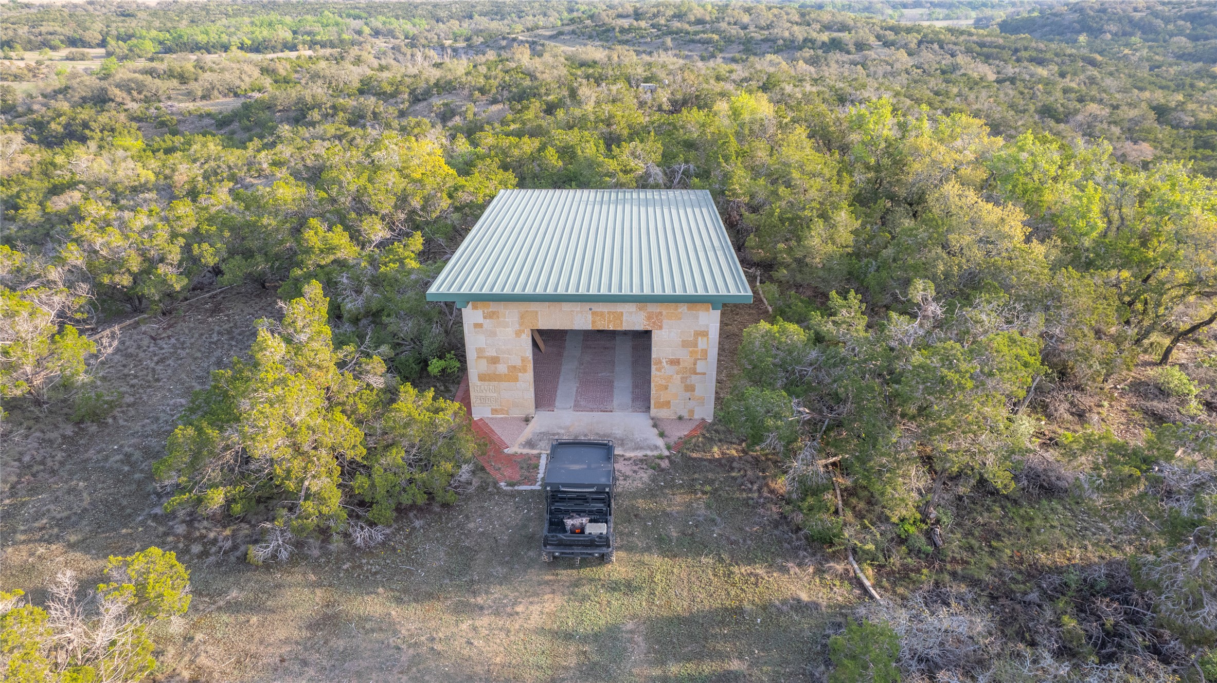 Tbd Bell Springs Road Dripping Springs, TX 78620 - Photo 33 of 40 View of outdoor structure featuring a wooded view
