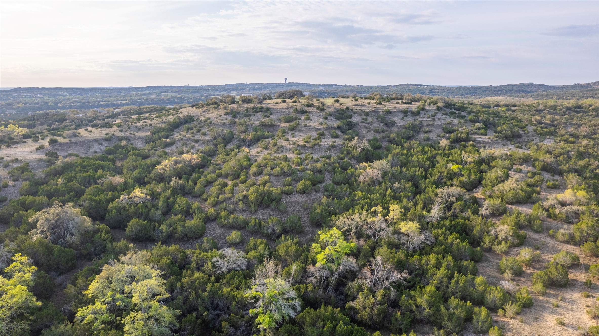 Tbd Bell Springs Road Dripping Springs, TX 78620 - Photo 7 of 40 Aerial view of a mountainous background and a heavily wooded area