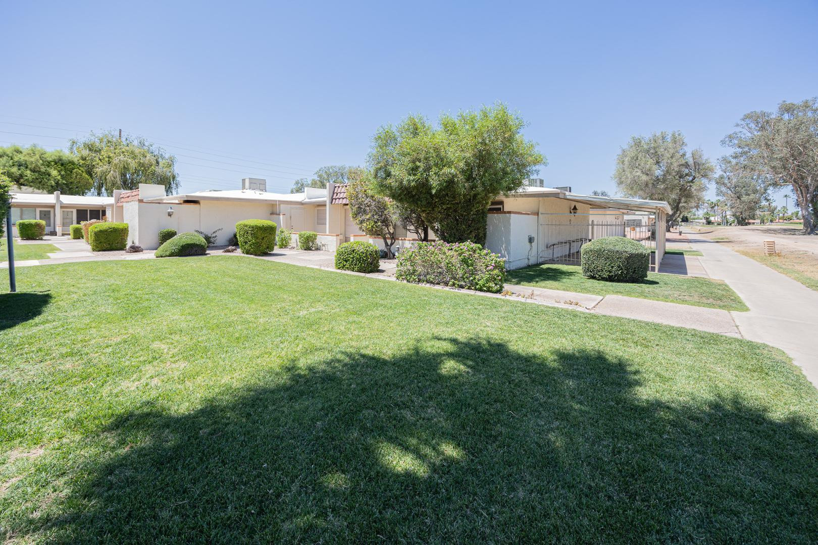 609 South Power Road, Unit 338 Mesa, AZ 85206 - Photo 3 of 24 a view of a house with backyard and a garden
