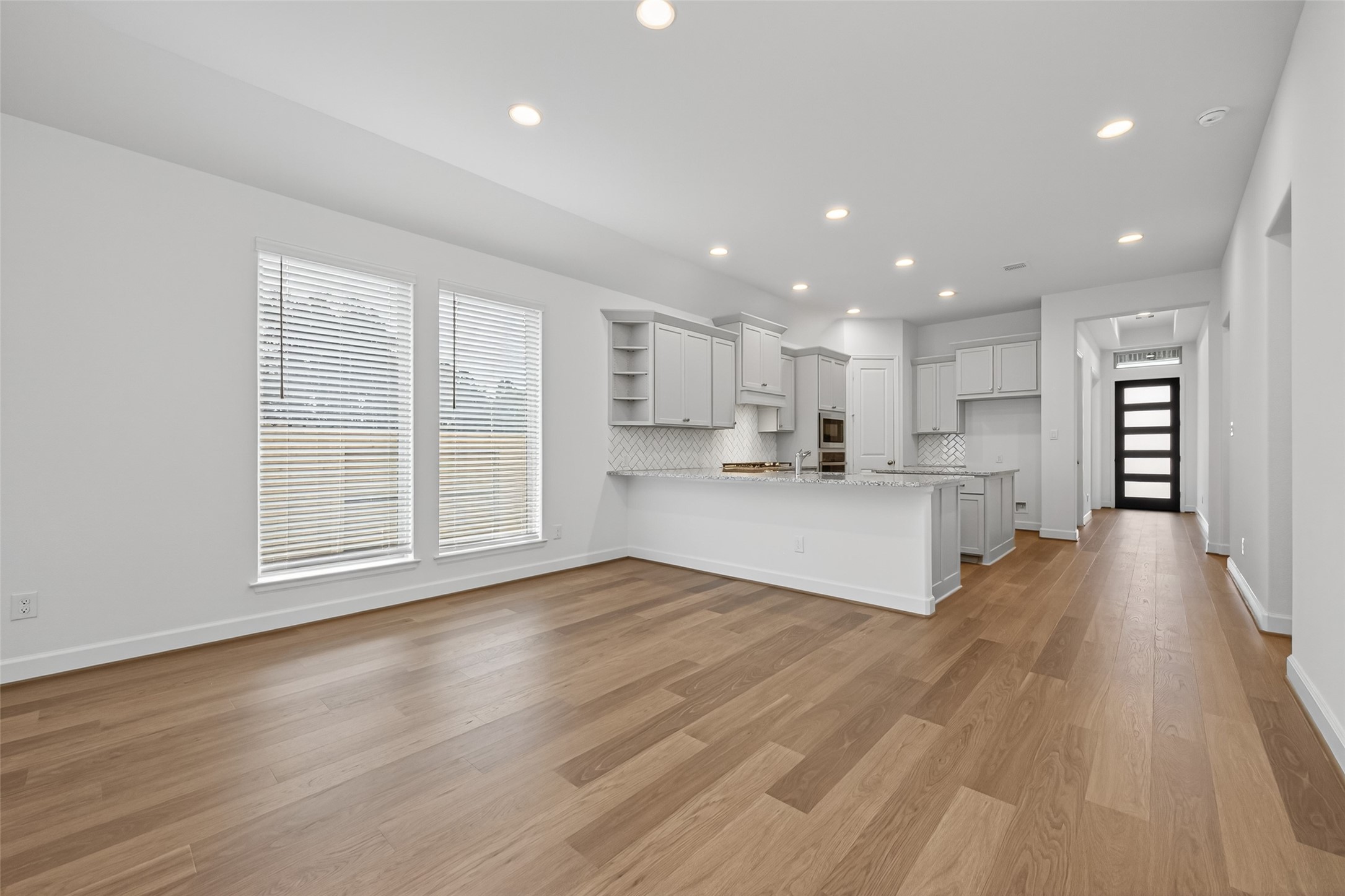 122 Sierra Strm Court Conroe, TX 77304 - Photo 16 of 40 a view of kitchen with wooden floor and window