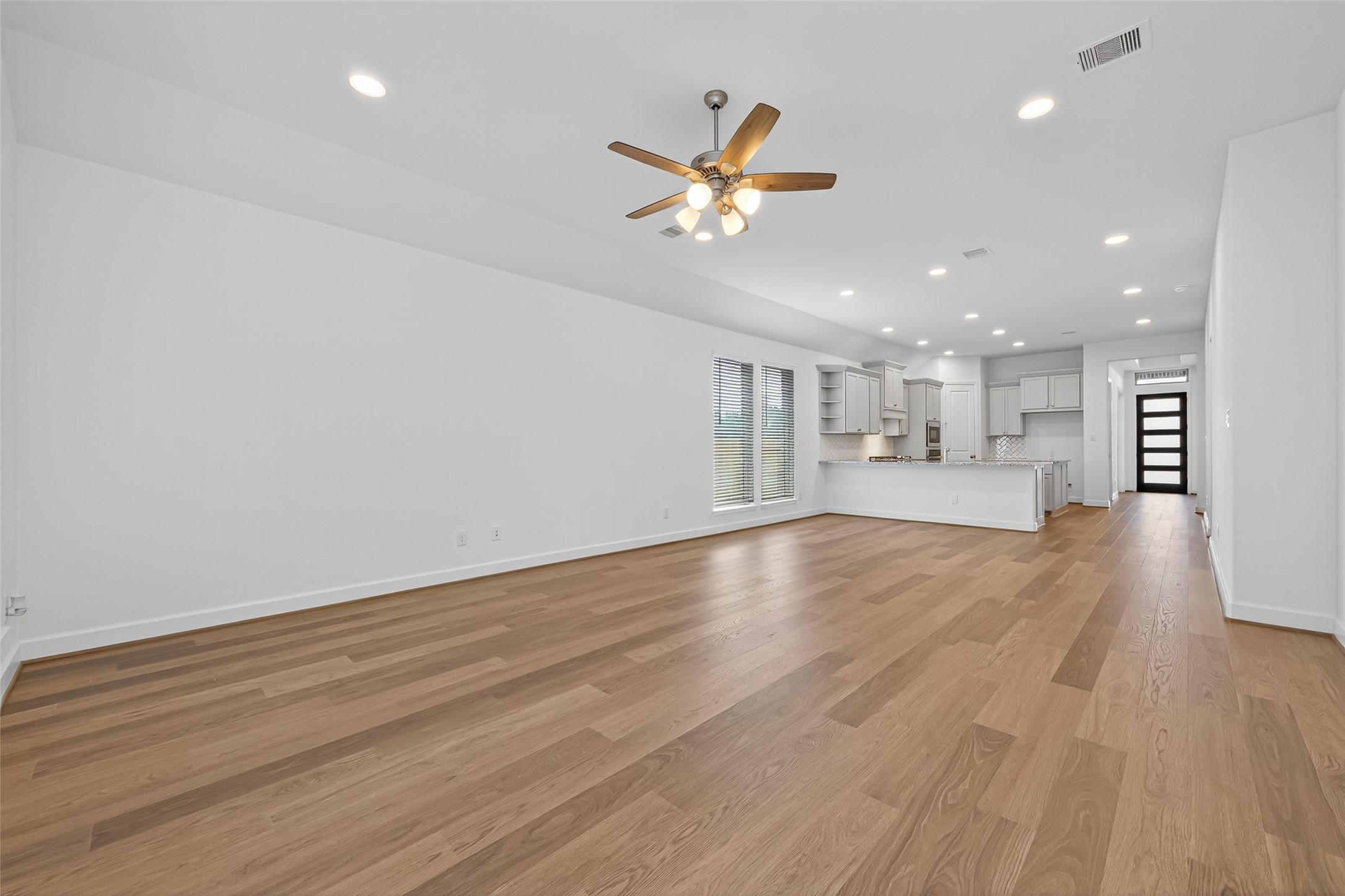 122 Sierra Strm Court Conroe, TX 77304 - Photo 18 of 40 a view of a room with a window and wooden floor