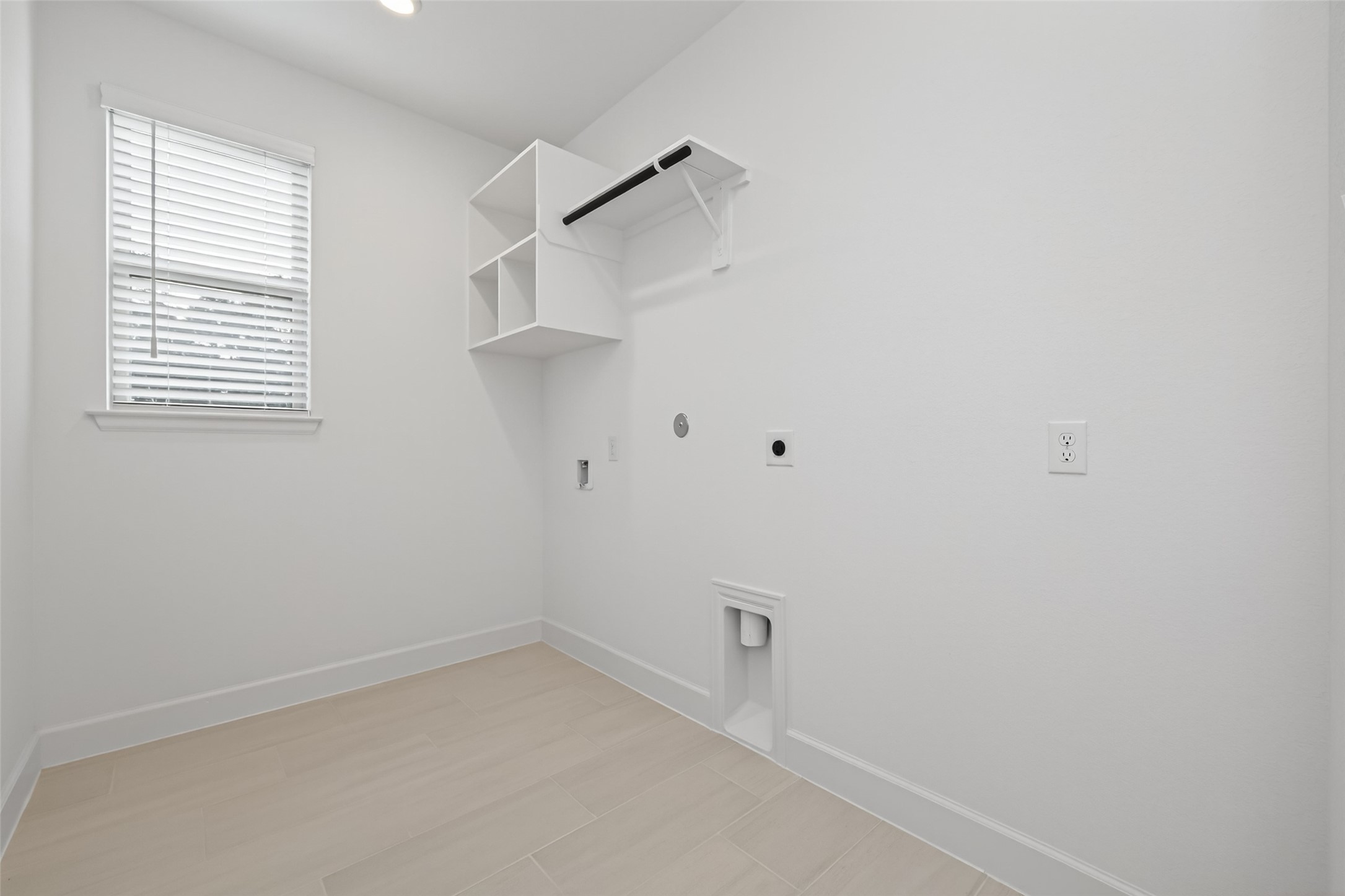 122 Sierra Strm Court Conroe, TX 77304 - Photo 21 of 40 a view of small space with white walls and a window