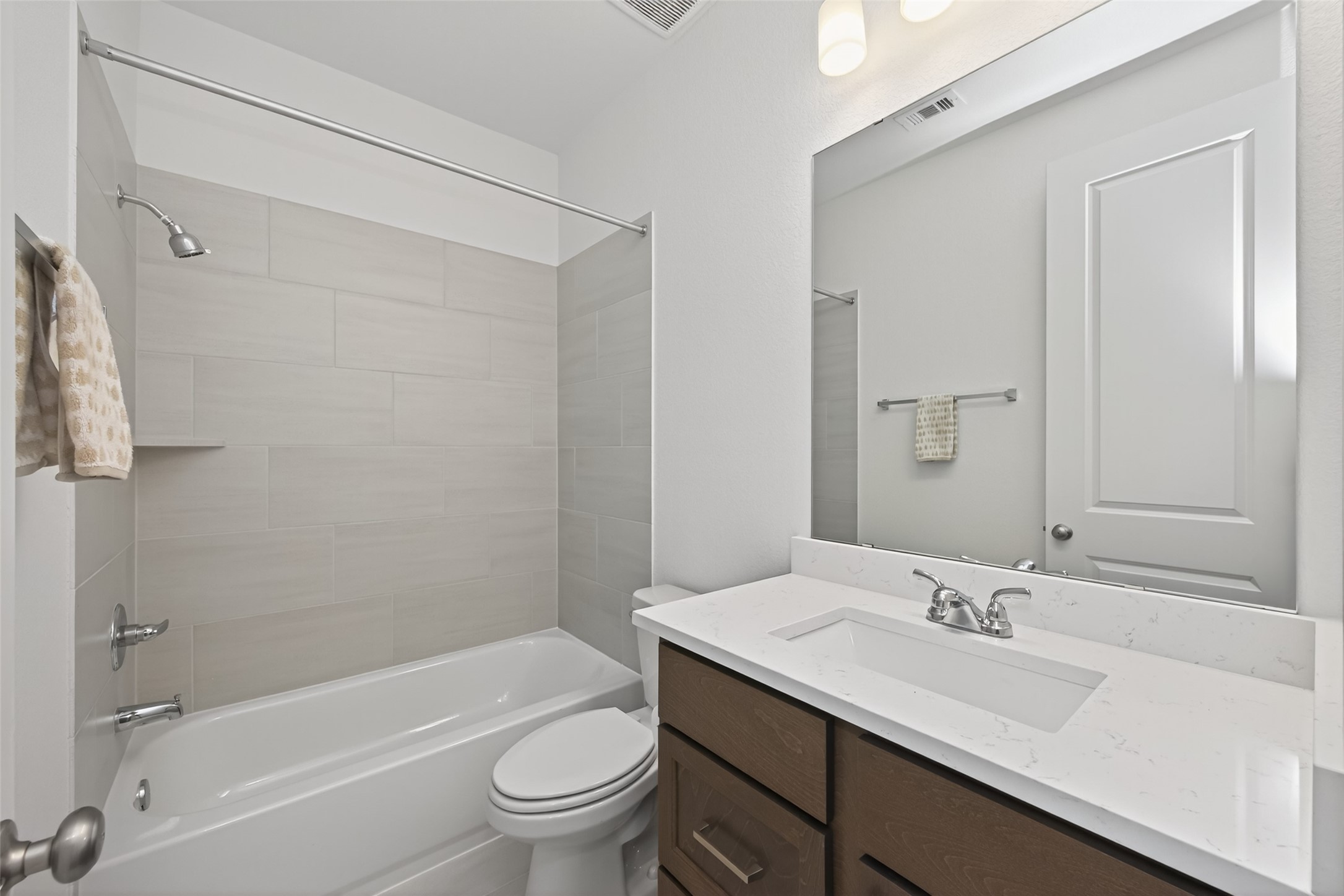 122 Sierra Strm Court Conroe, TX 77304 - Photo 22 of 40 a bathroom with a sink toilet vanity and shower