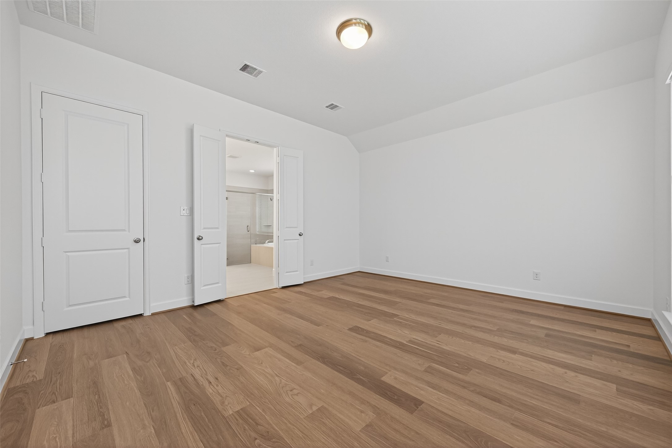 122 Sierra Strm Court Conroe, TX 77304 - Photo 27 of 40 a view of empty room with wooden floor
