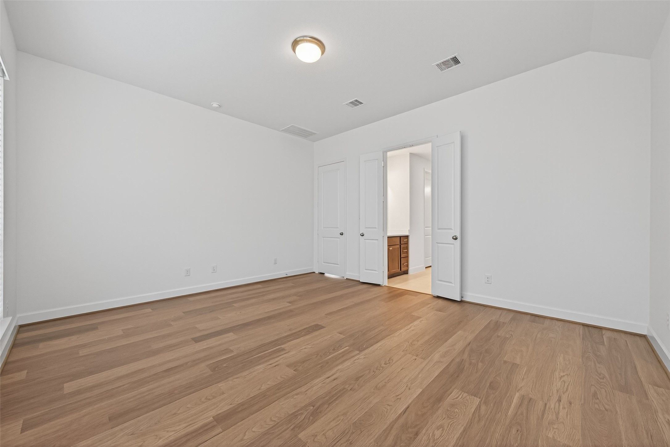 122 Sierra Strm Court Conroe, TX 77304 - Photo 28 of 40 wooden floor in an empty room