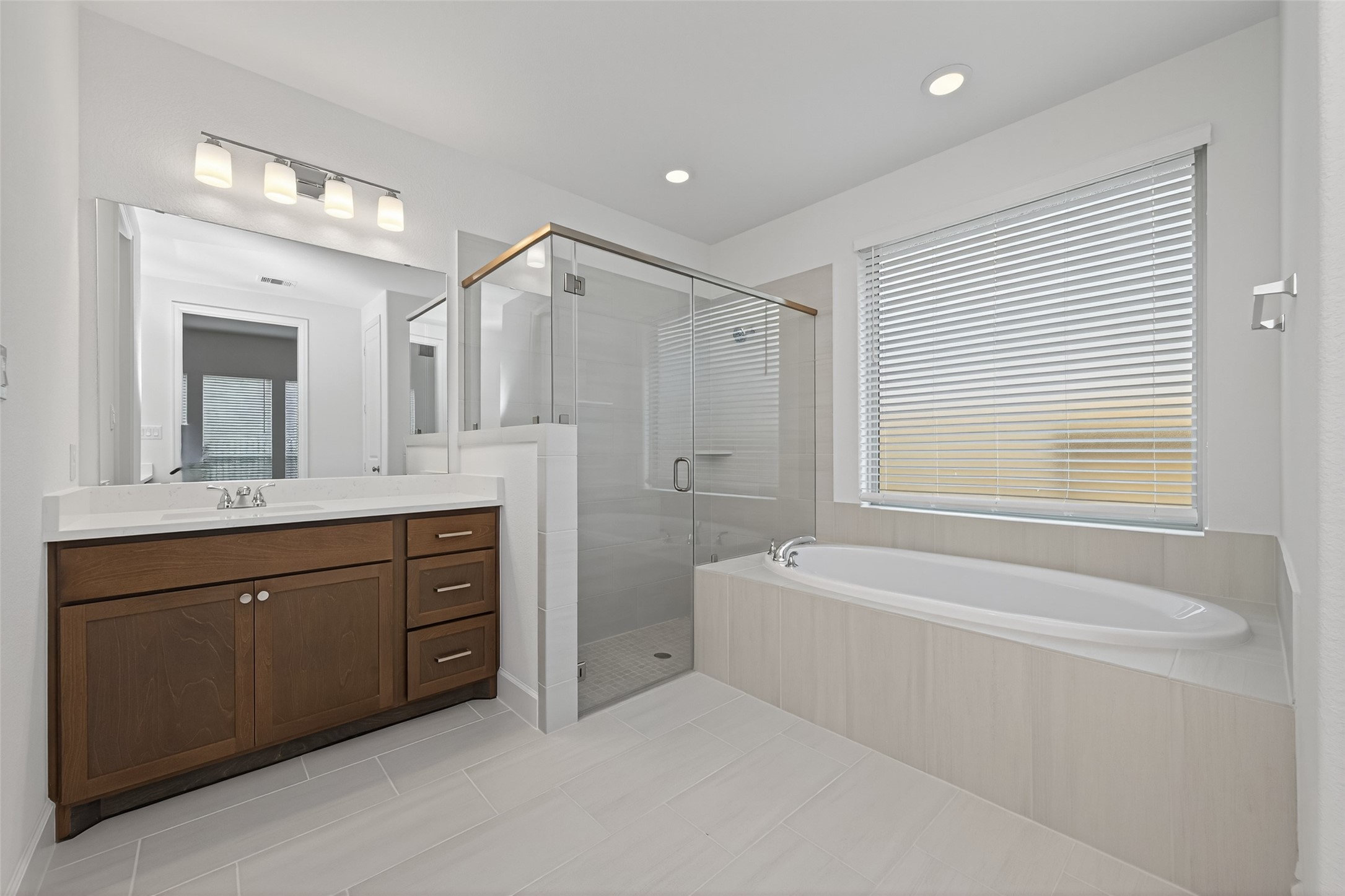 122 Sierra Strm Court Conroe, TX 77304 - Photo 30 of 40 a spacious bathroom with a tub sink shower and mirror