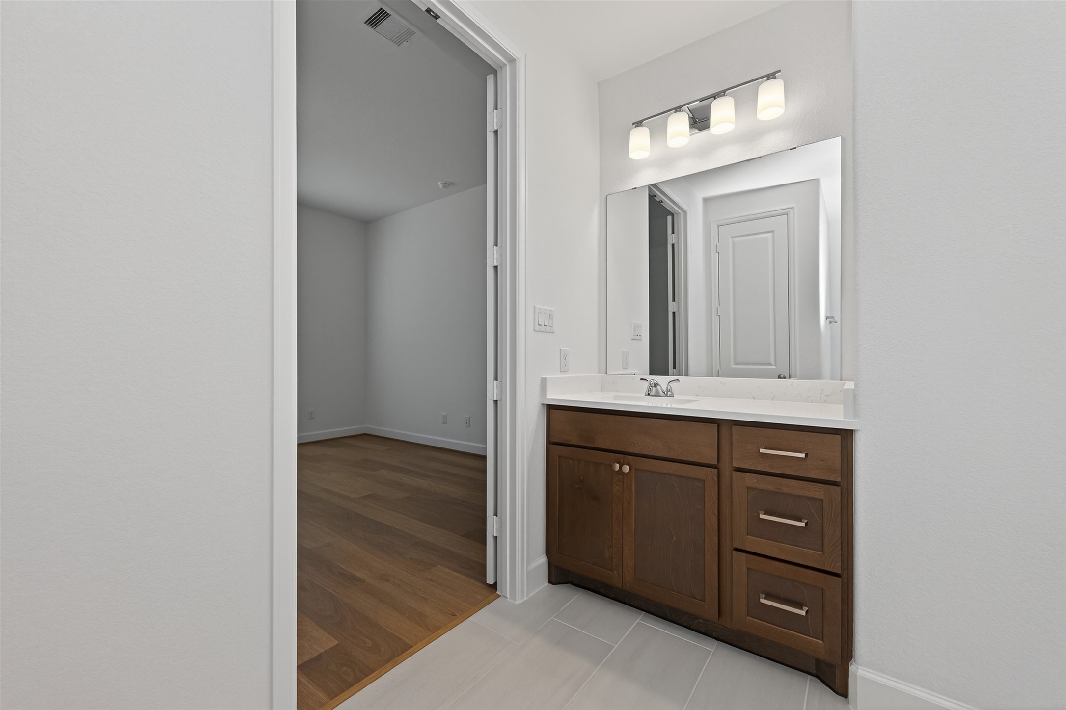 122 Sierra Strm Court Conroe, TX 77304 - Photo 32 of 40 a bathroom with a sink a vanity and a mirror