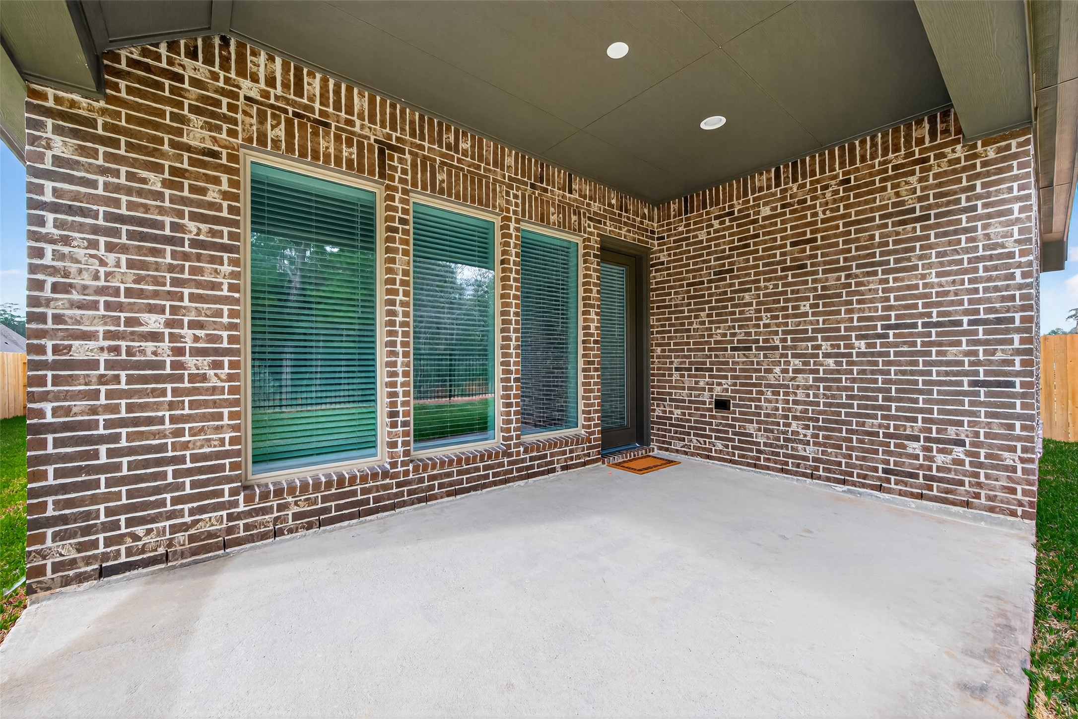 122 Sierra Strm Court Conroe, TX 77304 - Photo 38 of 40 a view of a building with glass door