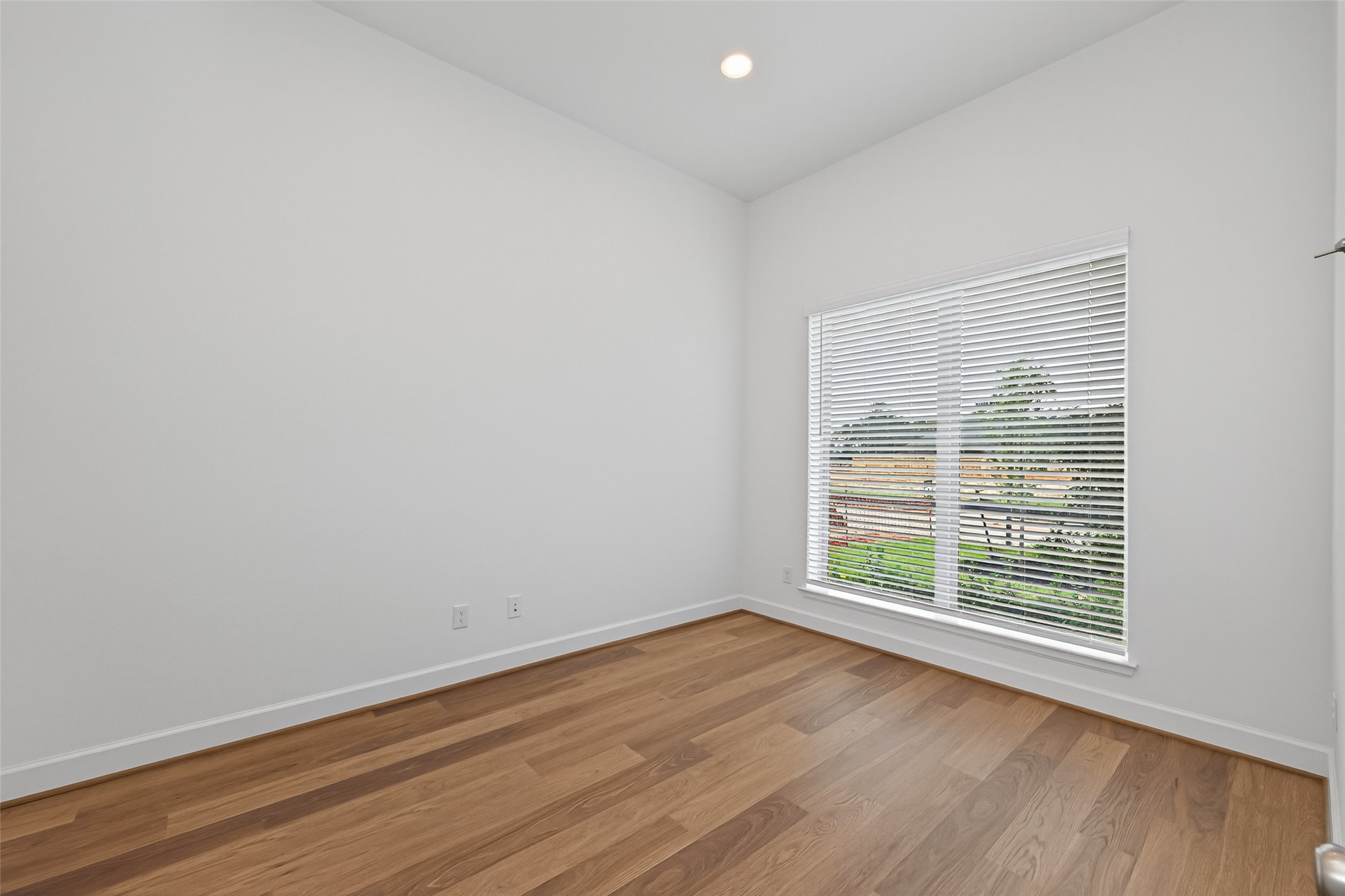 122 Sierra Strm Court Conroe, TX 77304 - Photo 5 of 40 wooden floor in an empty room with a window