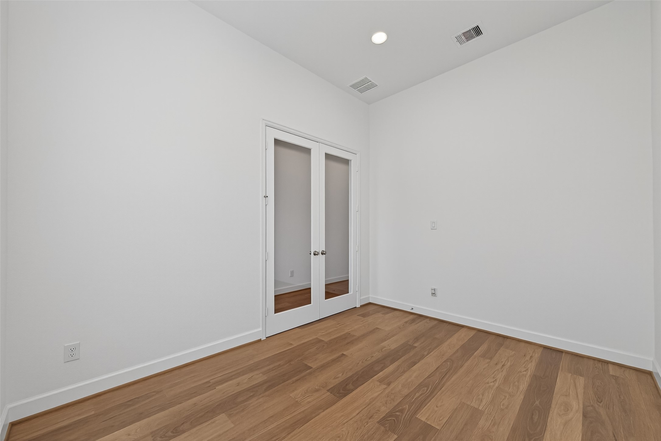 122 Sierra Strm Court Conroe, TX 77304 - Photo 7 of 40 a view of an empty room with wooden floor