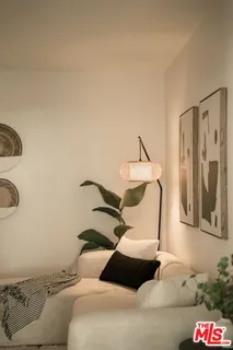 a bedroom with a bed and a chair