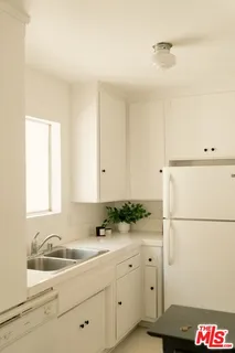 a bathroom with a sink and a window