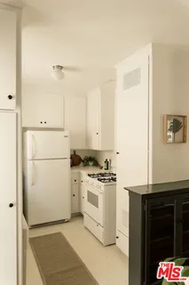a kitchen with a stove and a refrigerator
