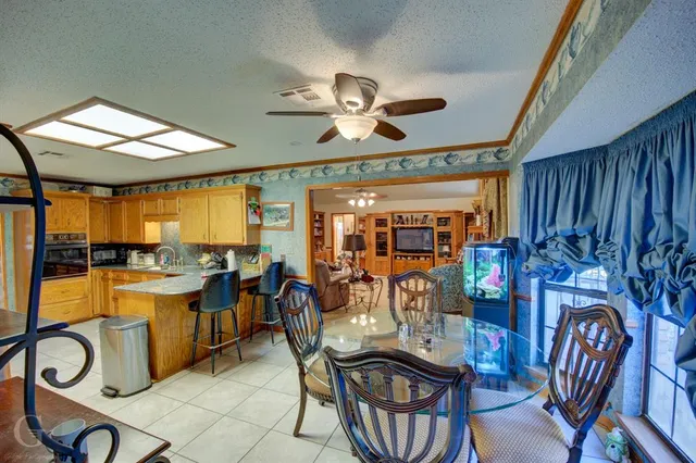 a living room with fireplace furniture and a flat screen tv